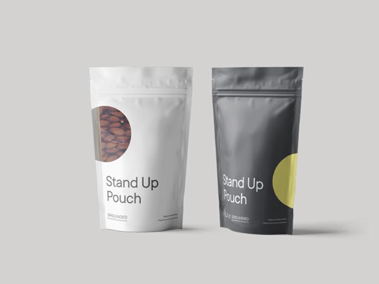 Two Grounded Packaging "stand up pouches" in black and white. 