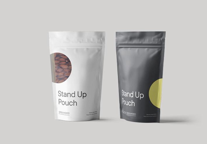 Two Grounded Packaging "stand up pouches" in black and white. 
