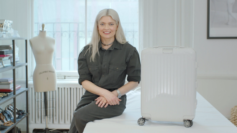 Stylist Kate Young with a white suitcase