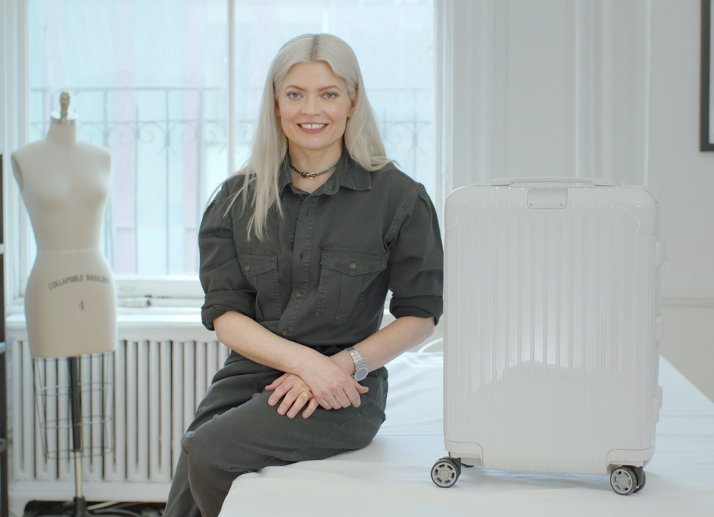 Stylist Kate Young with a white suitcase