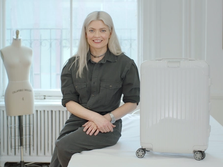 Stylist Kate Young with white suitcase