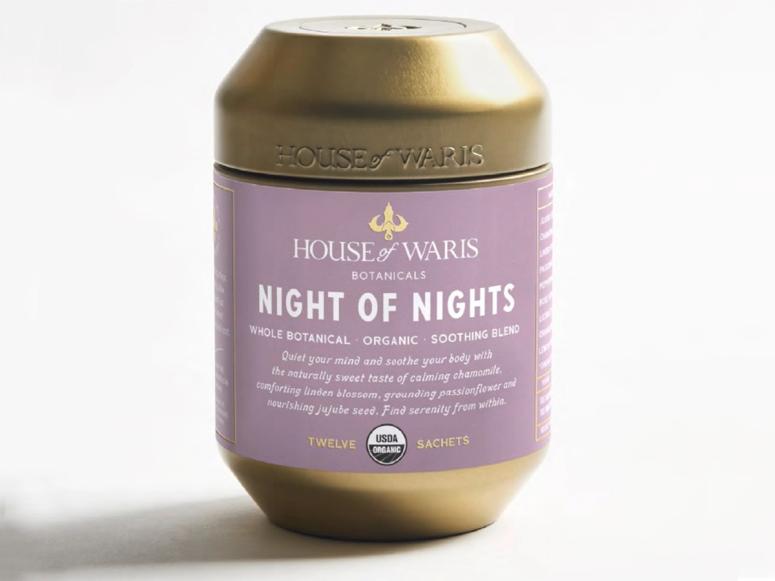 A purple and gold canister of House of Waris Night of Nights tea.