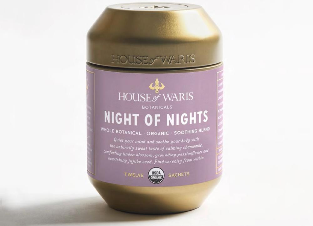 A purple and gold canister of House of Waris Night of Nights tea.