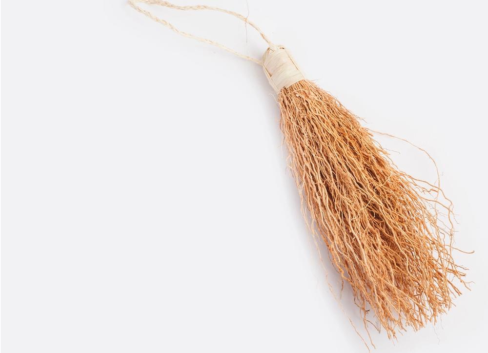A bundle of vetiver on a white background.