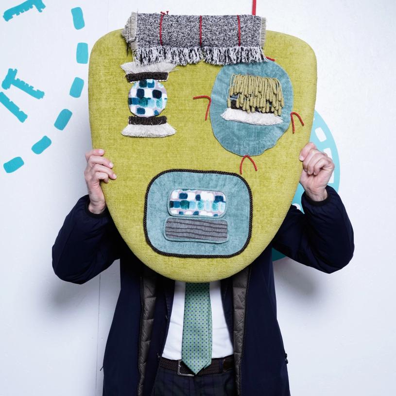 Lawyer Enrico Giovine with the piece of wall art he won at “Take It or Leave It.” (Photo: Mattia Gargioni)