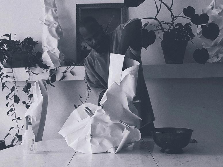 Bradley Bowers making one of his cotton paper lamps.