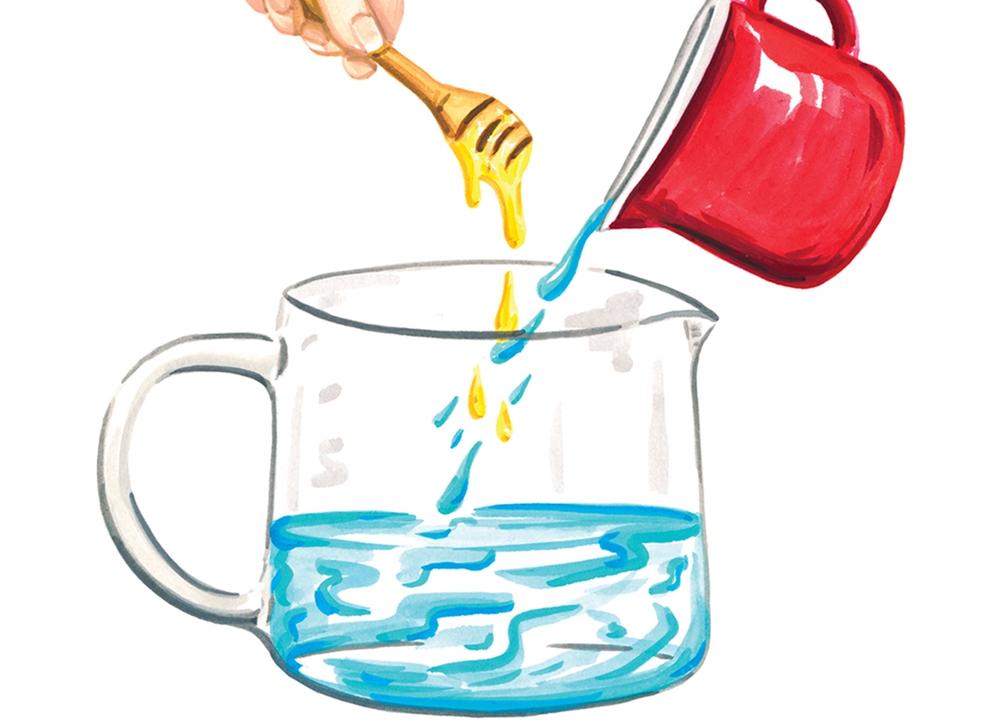 A pitcher of water with a hand holding a honey wand overhead.