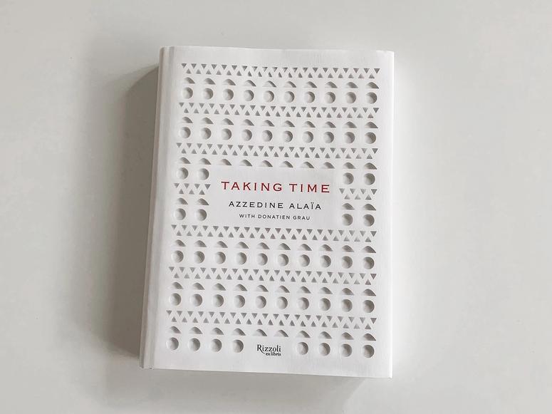 Azzedina Alaïa's Taking Time on a white desk.