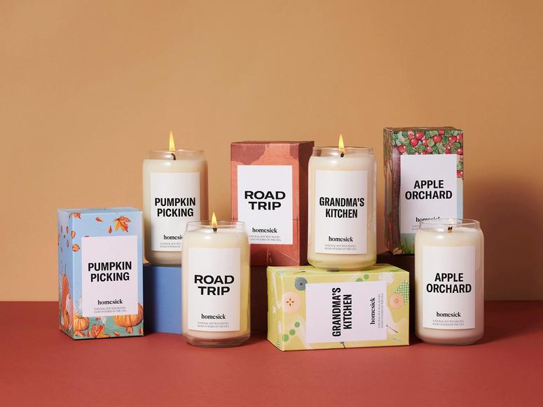 Colorful candles and boxes on a red and orange backdrop.