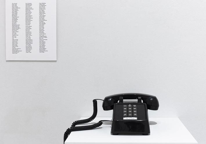 Giorno's Dial-a-Poem phone in a white gallery setting.