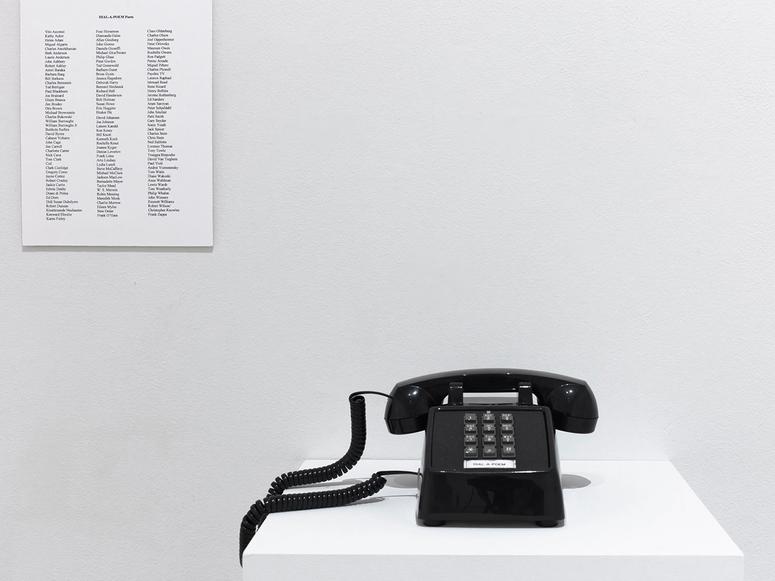 Giorno's Dial-a-Poem phone in a white gallery setting.