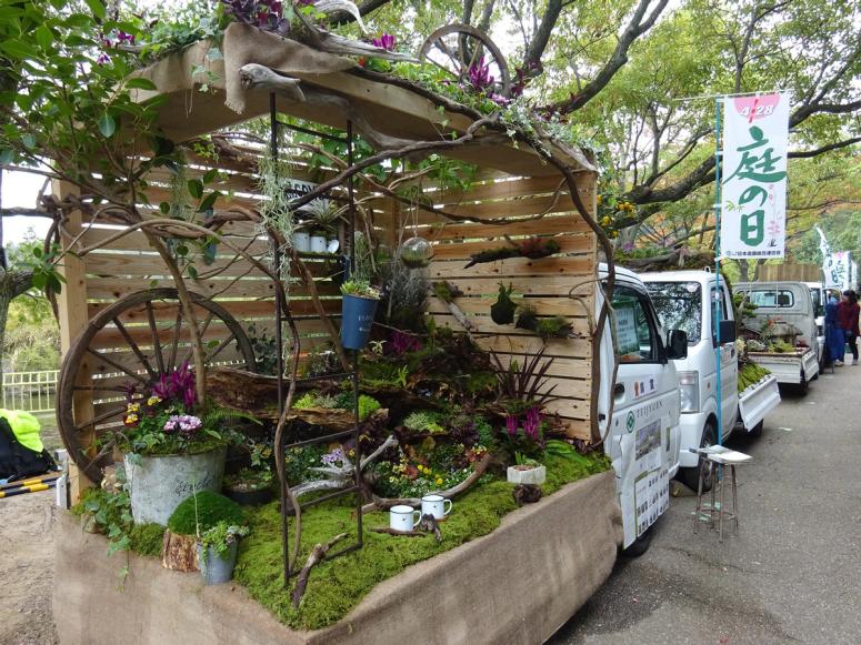 A small truck with a garden built inside the truck bed