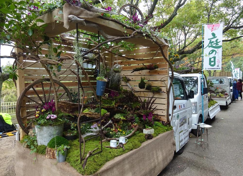 A small truck with a garden built inside the truck bed