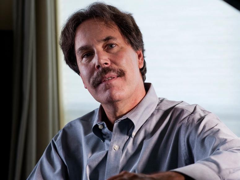 Ted Gioia in front of a large window.