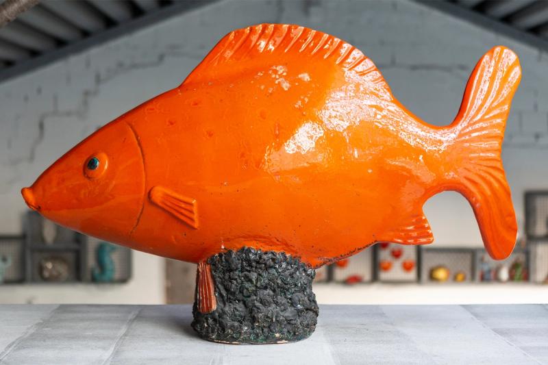 A reddish-orange ceramic fish on the mezzanine level of Navone’s home in Milan. (Photo: Antonio Campanella)