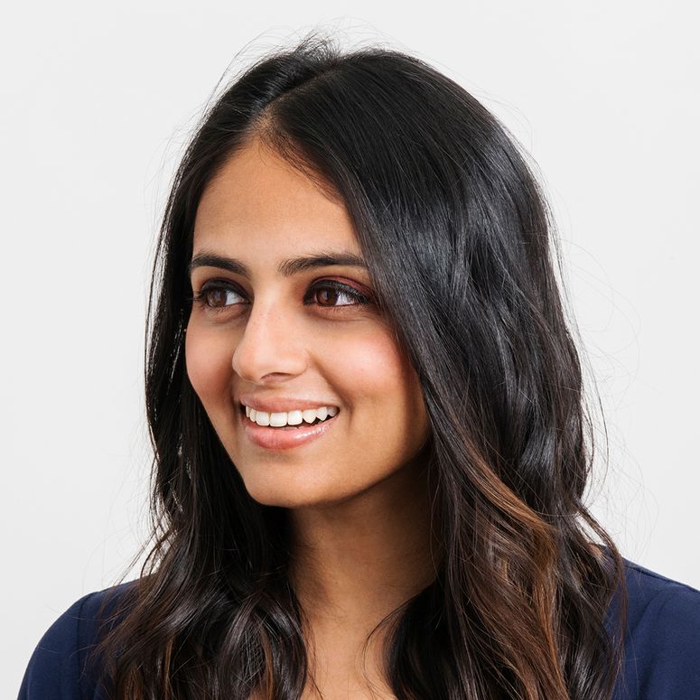 Aishwarya Iyer smiling and looking to the left.