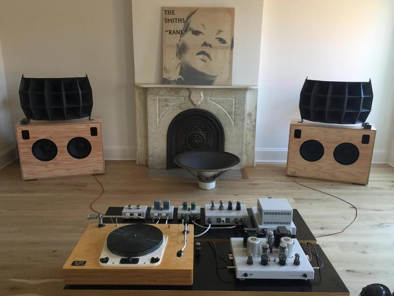 Ojas speakers, amplifiers, and turntable in an NYC apartment.
