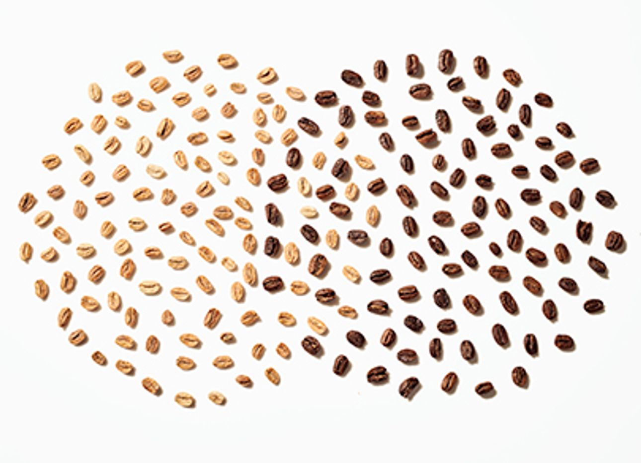 Unroasted and roasted coffee beans arranged in two, overlapping circles.