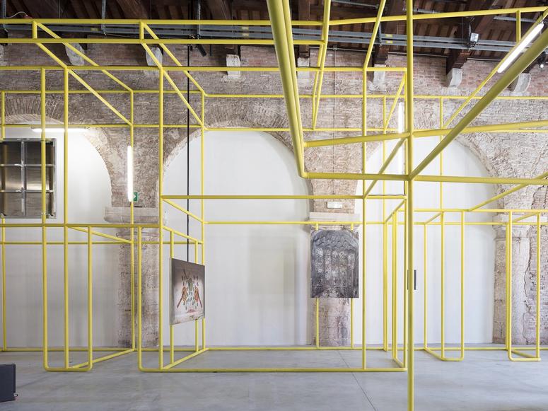 Interior of an industrial space with yellow scaffolding