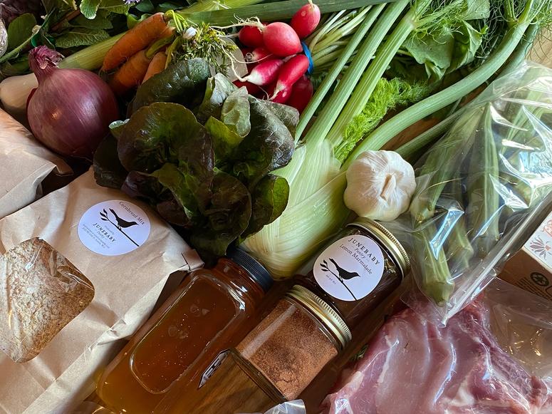 An assortment of vegetables, dried and preserved foods, meat, and drinks.