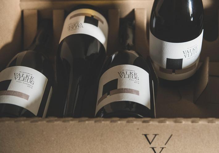 Four Valke Vleug wine bottles in a carton.
