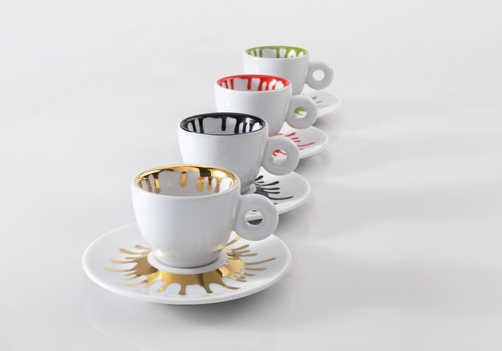 Four espresso cups and saucers with a paint splatter motif
