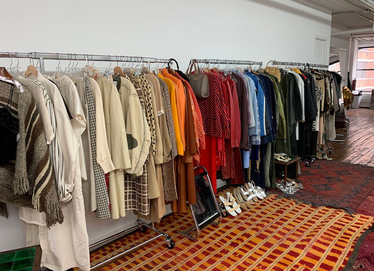 The interior of Object Limited, with racks of clothes along a wall.