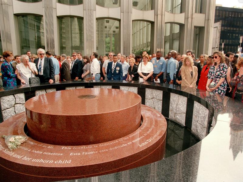Members of the public gathered around Zimmerman's 1993 World Trade Center Bombing Memorial