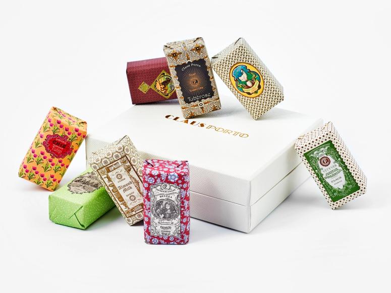 An assortment of colorful Claus Porto soaps on their white box.