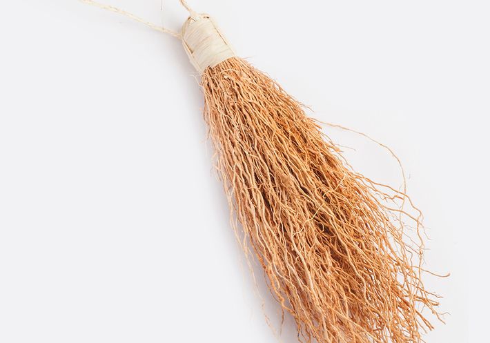 A bundle of vetiver on a white background.