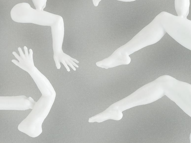 Disembodied plastic limbs on a grey background.