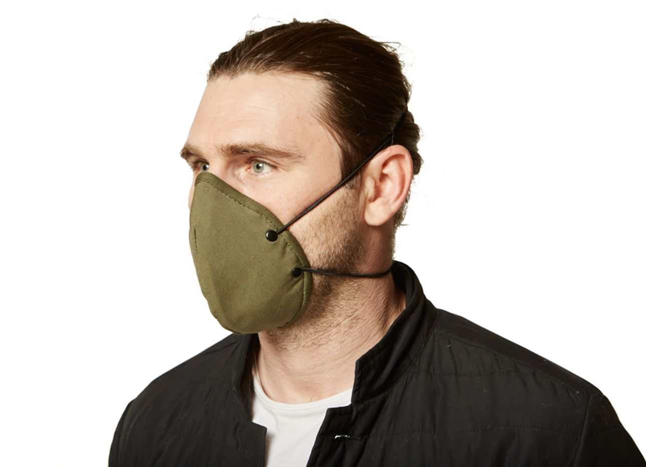 A man wearing an army green face mask.