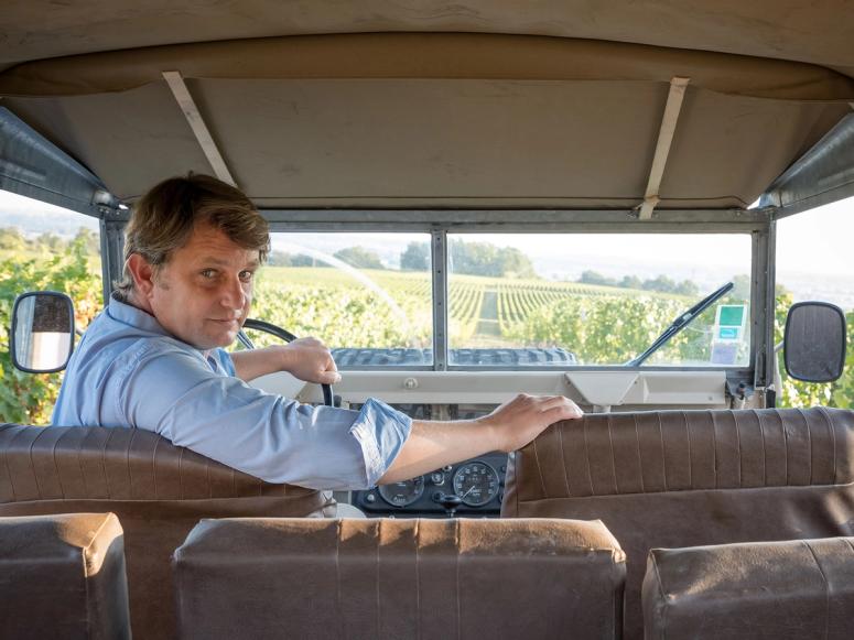 Aymeric de Gironde in an old truck on the vineyard.