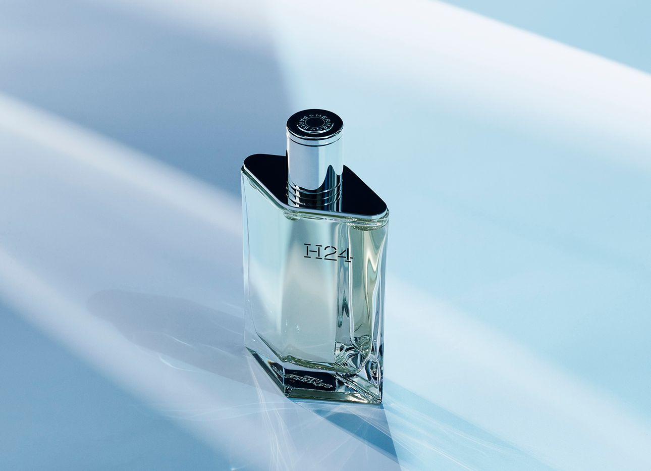 A bottle of Hermés's H24 in futuristic lighting.