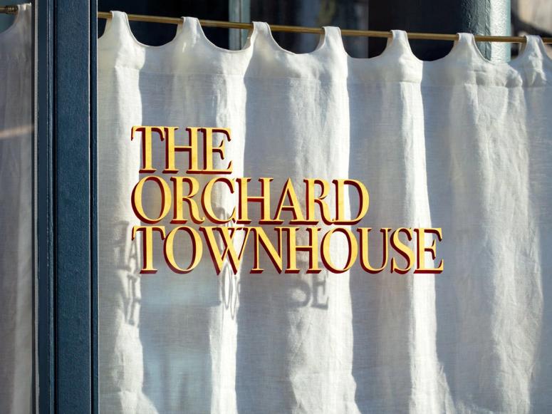 A window with lettering at The Orchard Townhouse.