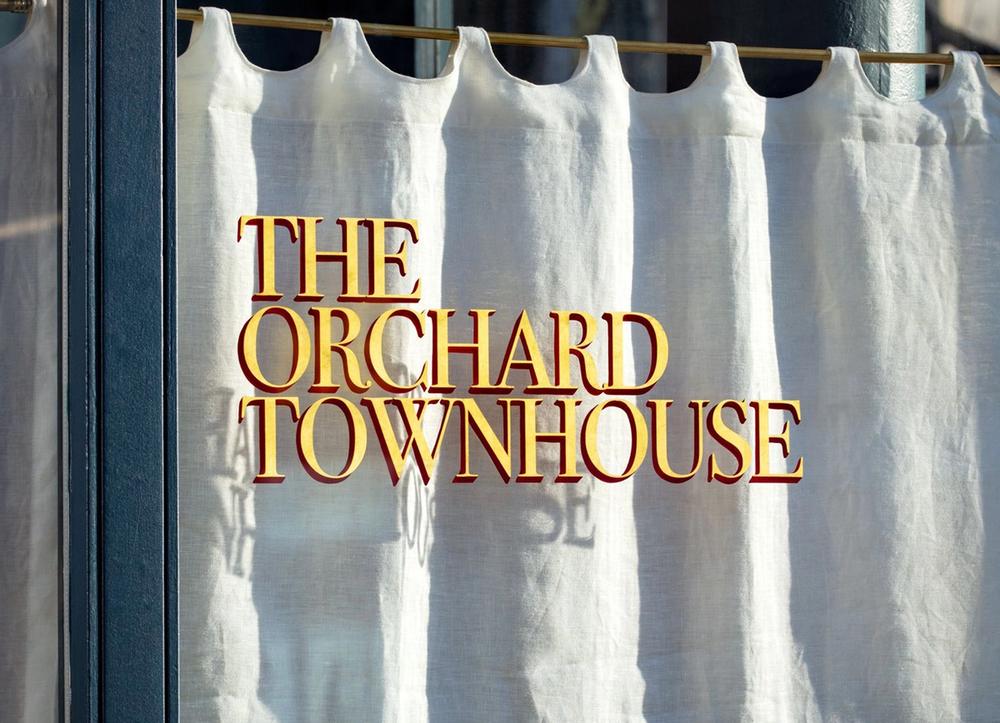A window with lettering at The Orchard Townhouse.
