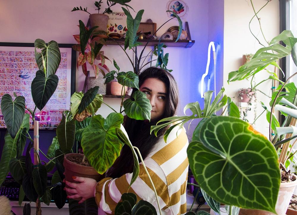 Alessia Resta in her plant-and-neon-filled apartment.