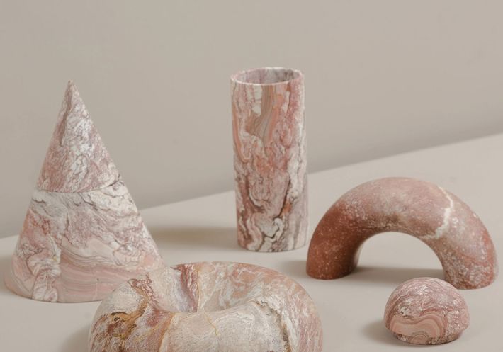 Rodrigo Bravo's pink marble vessels in various shapes.