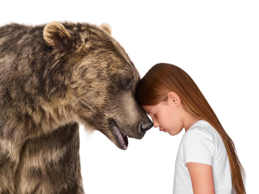 Photo of child with bear from The Lion's Share campaign