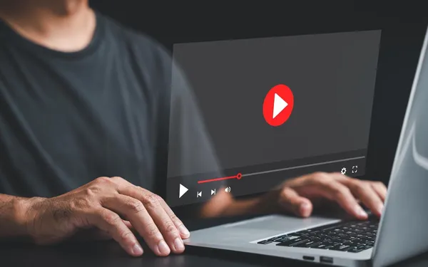 Motion design business presentation video playing on a laptop screen
