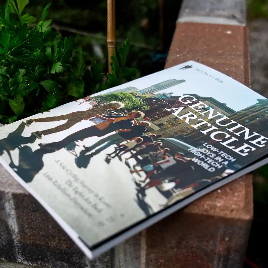 Genuine Article Magazine lying on bricks