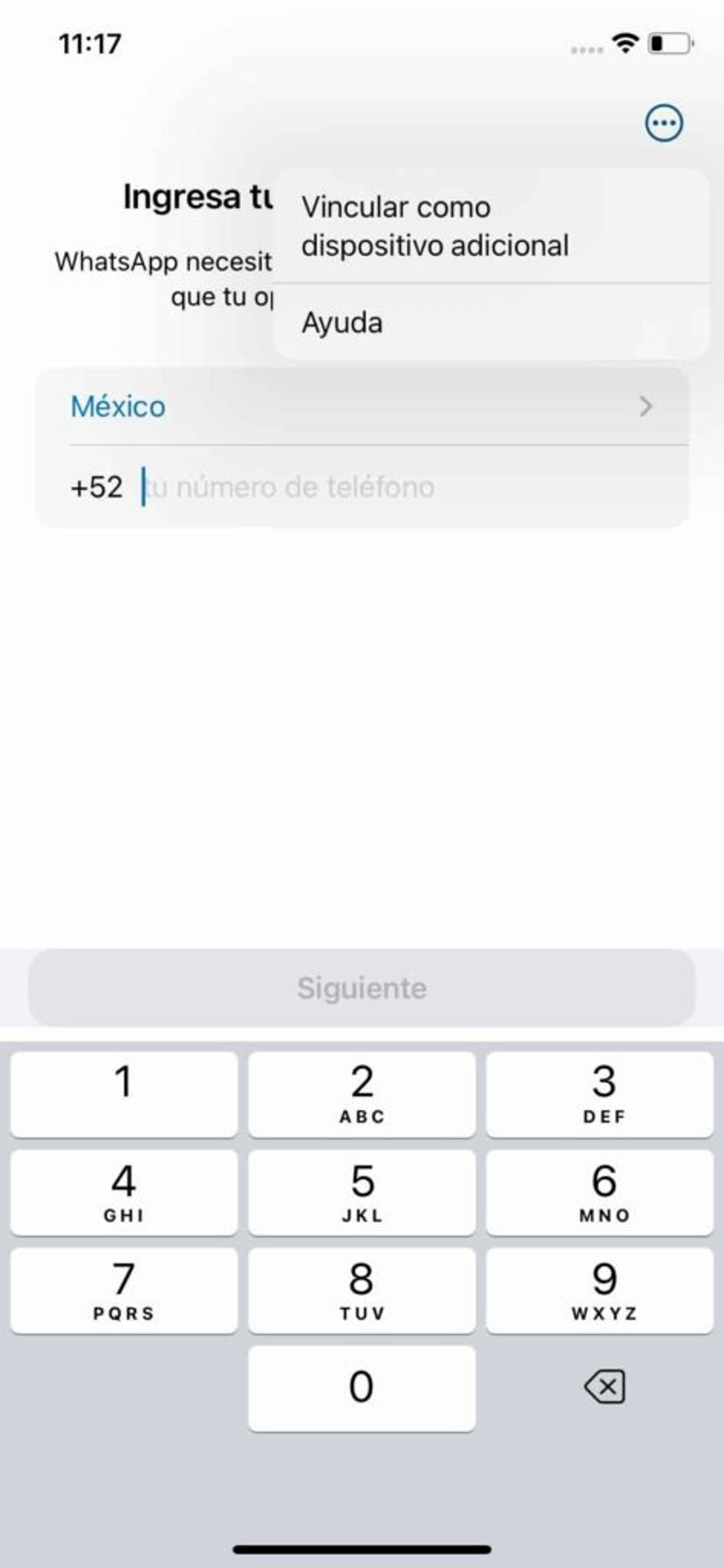 Pantalla inicial de WhatsApp Business con opciones "Vincular como dispositivo adicional" y "Ayuda". Muestra selector de país (México +52) y campo de entrada de número de teléfono con teclado numérico visible y botón "Siguiente" deshabilitado. Este es el primer paso para vincular un nuevo dispositivo a la cuenta de WhatsApp Business.