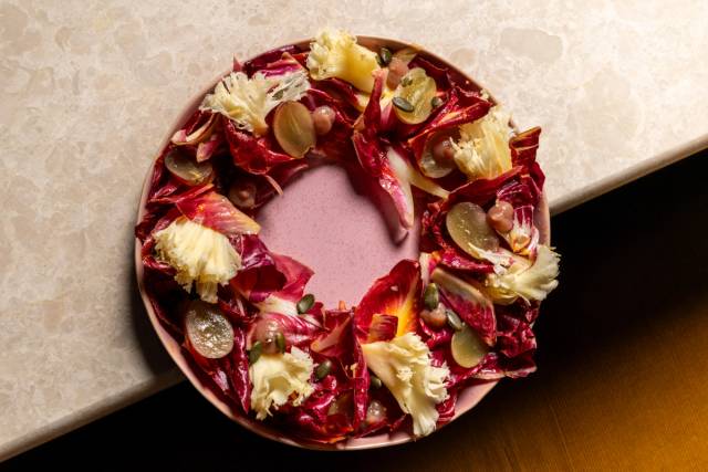 Red endive salad, ginger carrot vinaigrette, tête de moine