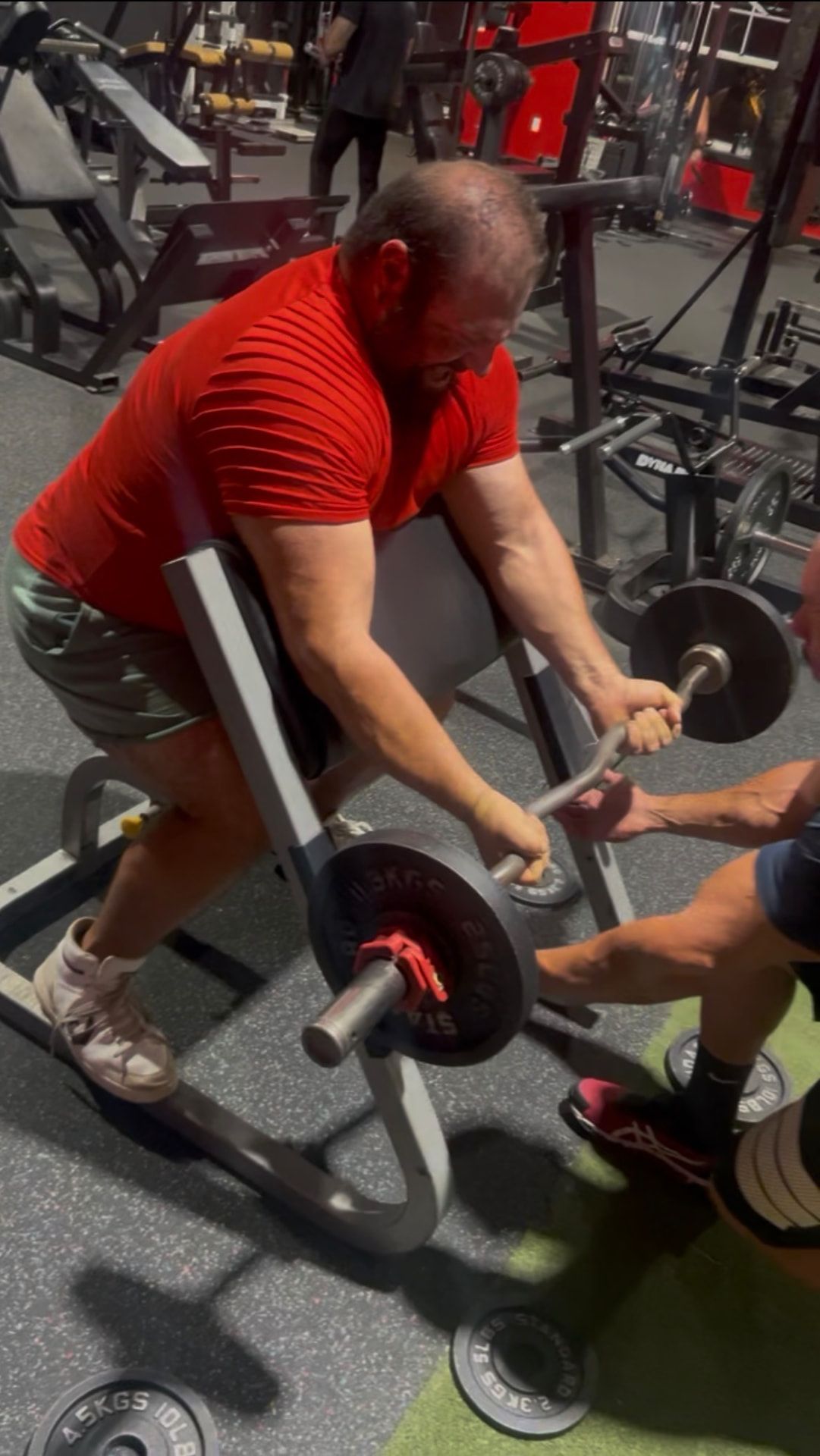 Members strength training inside The Iron Village gym in Oxford, Florida.