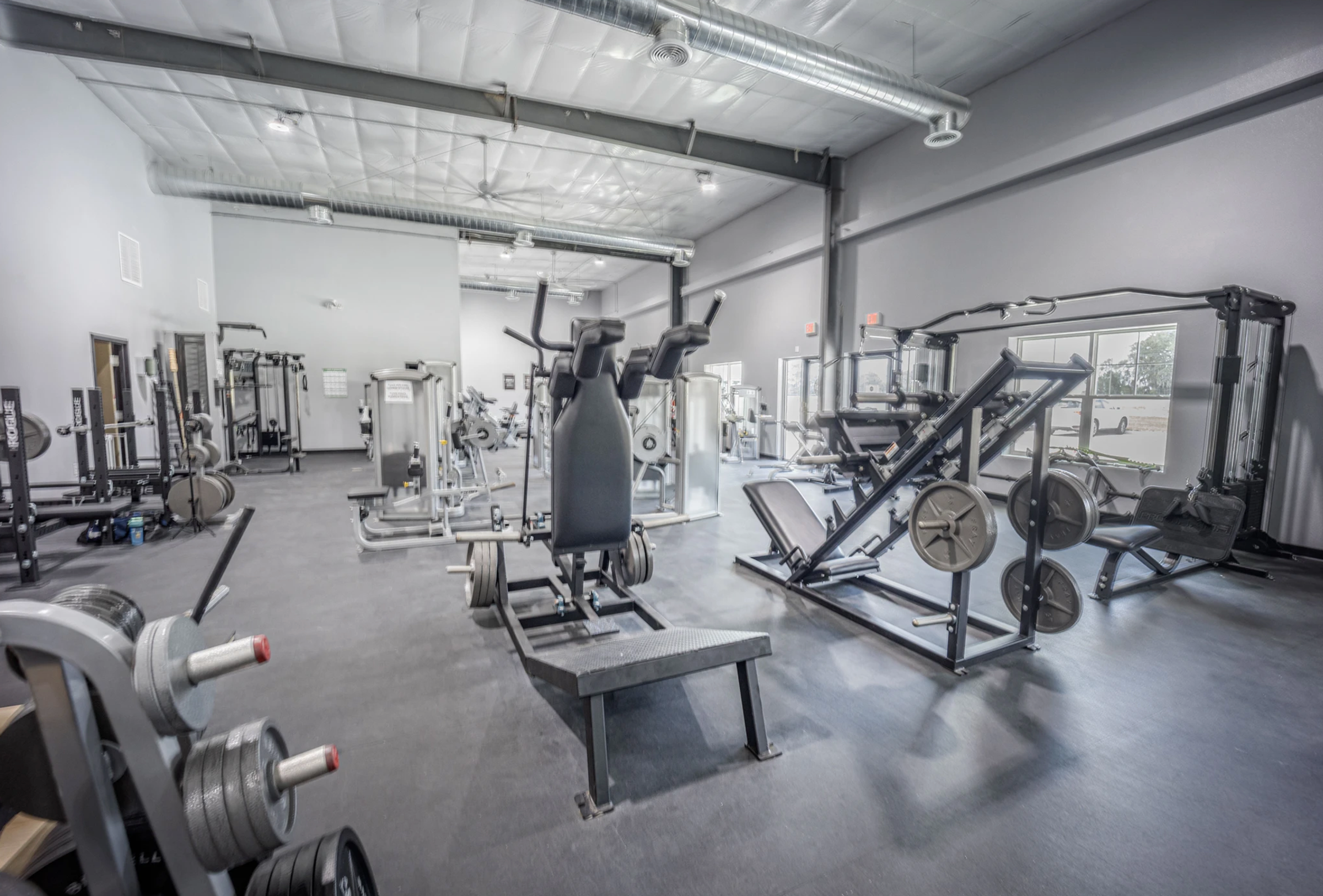 Strength training and circuit training equipment at The Iron Village gym.