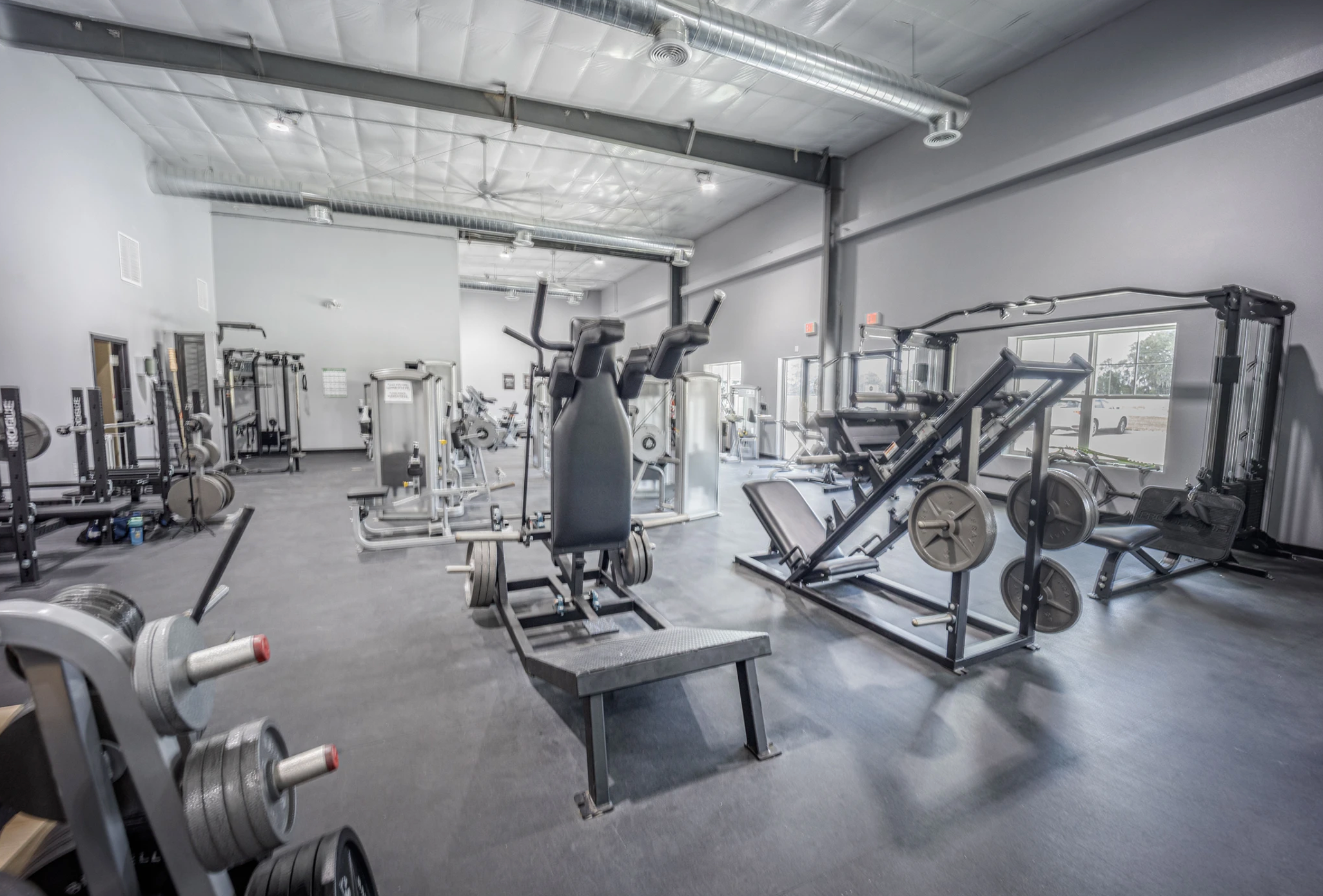 Strength training and circuit training equipment at The Iron Village gym.