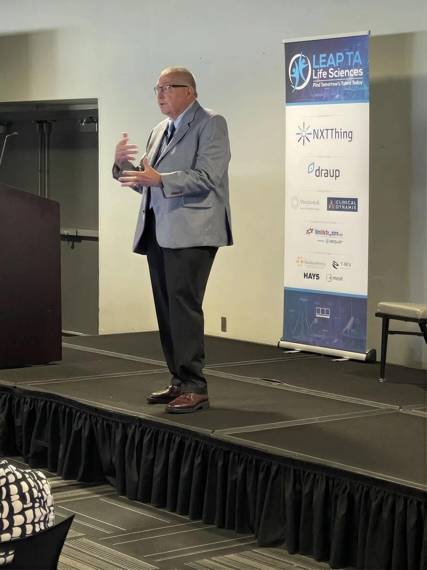 Terry Terhark speaking on stage at LEAP TA Life Sciences