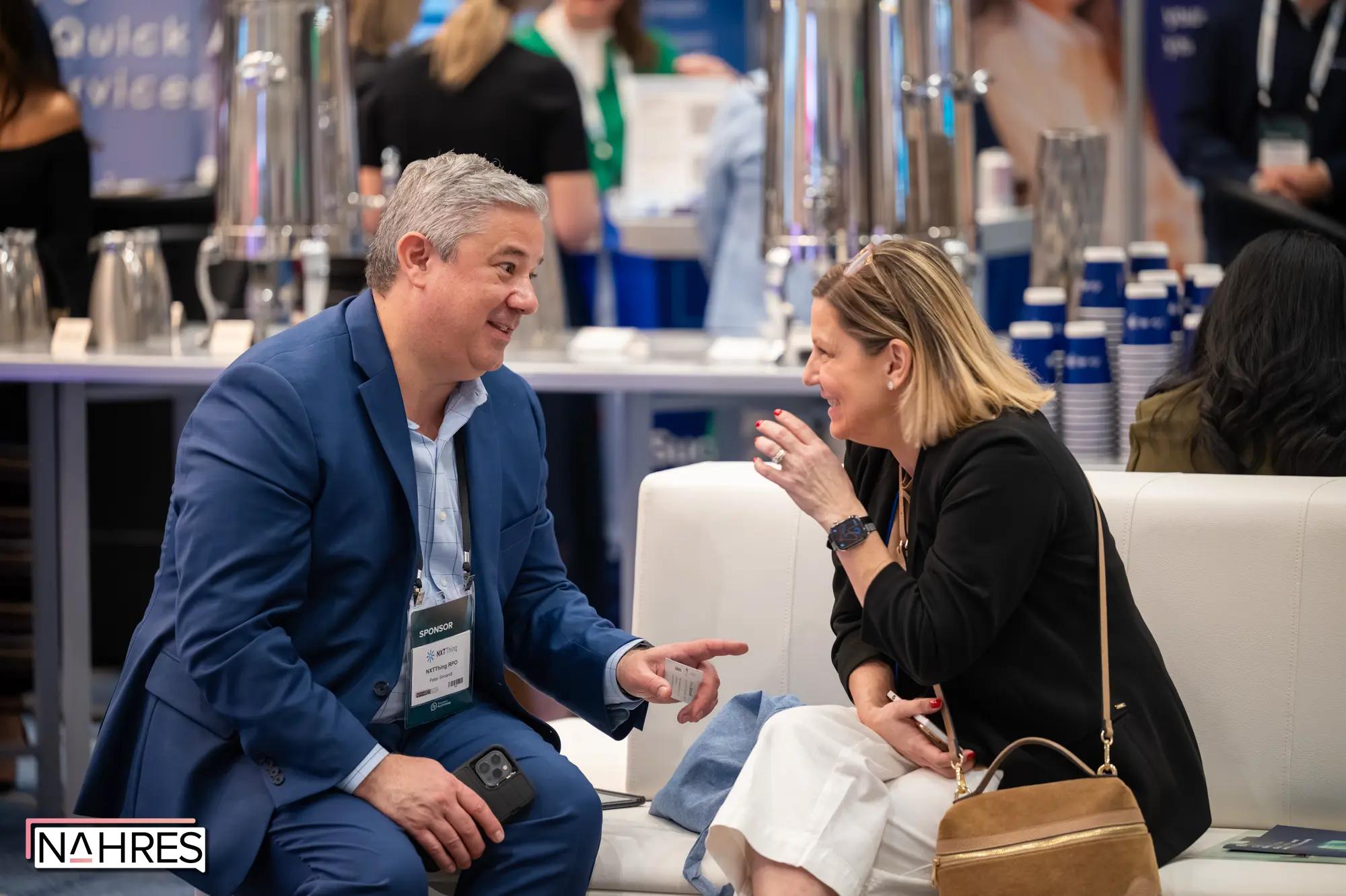 Terry in peer conversation at a networking event