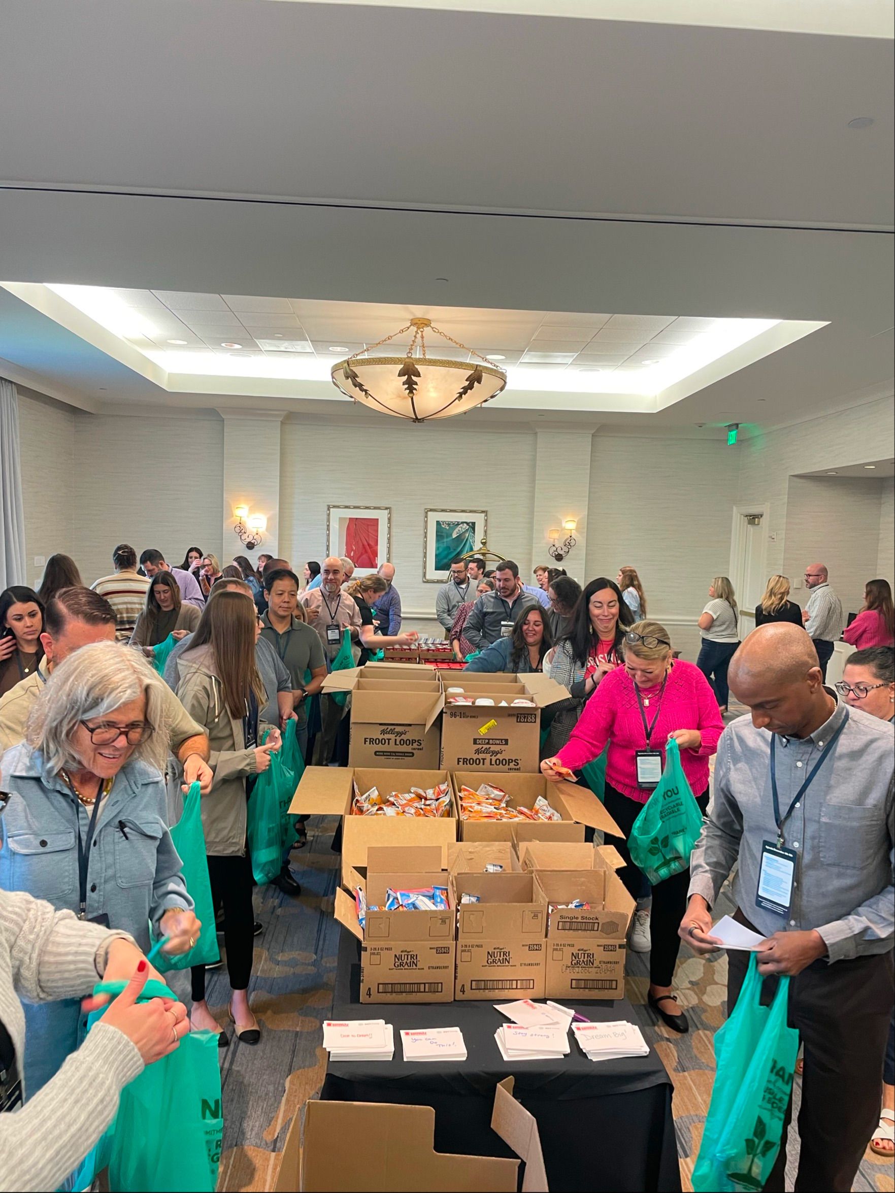 NXTThing colleagues packing food donations for the community