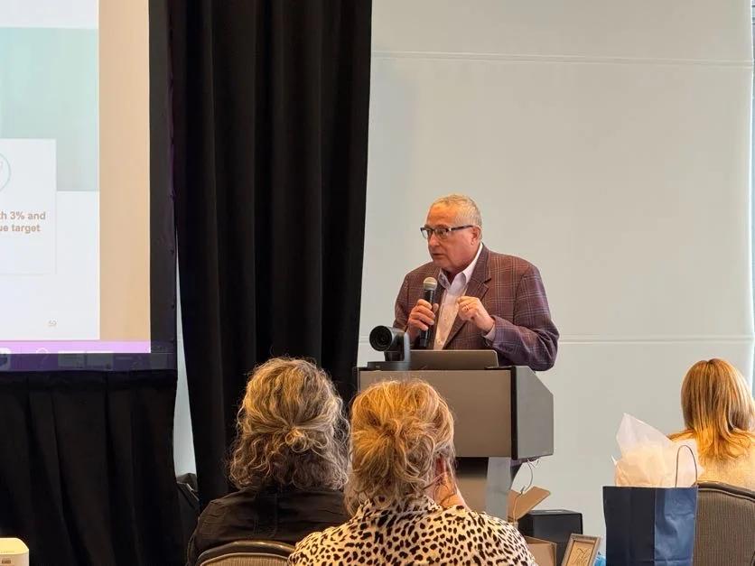 Terry Terhark speaking to an audience at an NXTThing event
